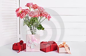 Valentine`s day greeting card. Flowers and gifts boxes on white background. Happy birthday and mother`s day template