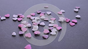 Valentine`s day heart shaped candy falling and bouncing