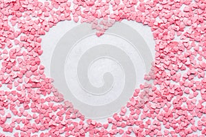 Valentines day heart shaped frame background made of candies.