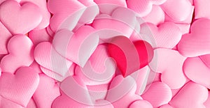 Valentine`s Day. Holiday abstract pink Valentine background with satin hearts. Love concept