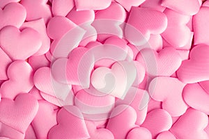 Valentine`s Day. Holiday abstract pink Valentine background with satin hearts. Love
