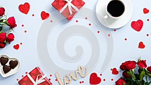 Valentine`s day holiday card. Flat lay presents, red hearts shape, candy, coffee cup, rose flowers, text sign