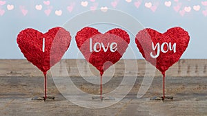 Valentine`s Day / I love you background banner panorama greeting card - 3 red balloon hearts on rustic vintage wooden table