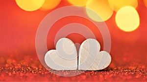 Valentine's Day. Love symbol. two white hearts on a red glitter background with gold bokeh. Valentines day background in