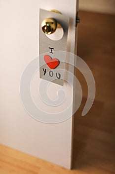 Valentine's day lovely message hanging on a door.