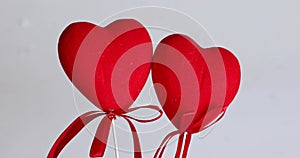 Valentine`s Day. lovers` day. two red toy hearts together and forever