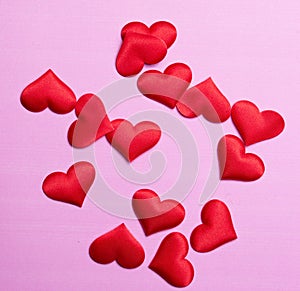 Valentine's day many red hearts on pink paper background, love concept for 14 february or valentine day