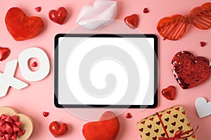 Valentine`s day online dating concept with digital mock up,  gift box and heart shape on pink background