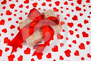 Valentine`s Day. Presented as a red ribbon on a white paper with red hearts