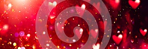 Valentine`s Day red Background. Holiday Blinking Abstract Valentine Backdrop with Glowing Hearts. Heart Shape Bokeh