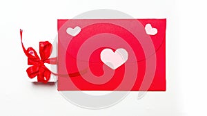 Valentine`s Day. Red an envelopes with heart and gift box with red bow. Writing a love letter. Message.Top view. Valentine concep