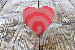 Valentine`s Day. red heart on the background of old boards