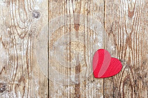 Valentine`s Day. red heart on the background of old boards