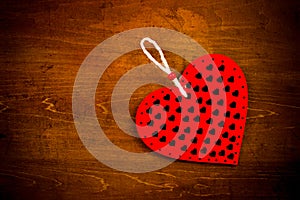 Valentine`s day. Red heart on old wooden background