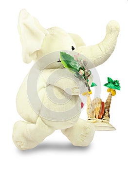 Valentine`s Day, a red heart, a white plush elephant, carries a green branch, an island of shells