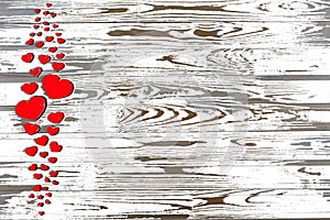 Valentine`s Day. Red hearts on a white wooden background