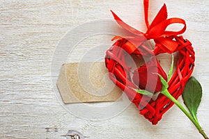 Valentine`s day, red rose, wicker heart