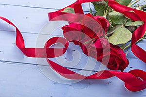 Valentine's Day: red roses and ribbons