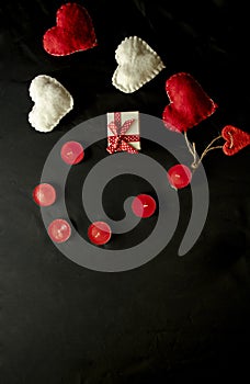 Valentine`s Day. Red and white hearts on craft paper background. Beautiful red heart of roses, felt handmade. Black