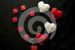 Valentine`s Day. Red and white hearts on craft paper background. Beautiful red heart of roses, felt handmade. Black