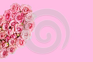 Valentine`s day romantic greeting card. Composition with a heart of pink roses on a pink background.Mothers day. 8 Marth. Banner