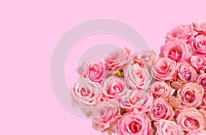 Valentine`s day romantic greeting card. Composition with a heart of pink roses on a pink background.Mothers day. 8 Marth. Banner