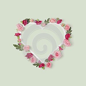Valentine`s day romantic heart shaped frame with flowers.