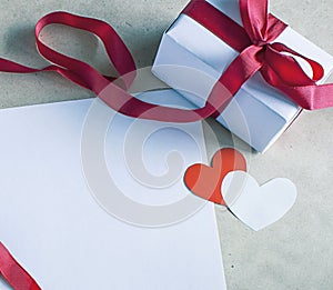 Valentine`s Day, romantic template with paper hearts, red bow ribbon and white vintage lace