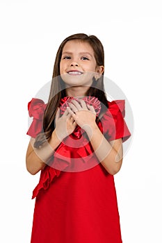 Valentine`s day. smiling child girl with red heart