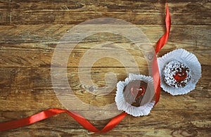 Valentine`s day, sweet pastries, hearts, scarlet silk ribbon