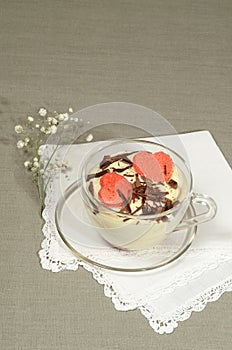 Valentine's Day tiramisu with chocolate in glass cup.