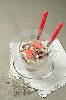 Valentine's Day tiramisu with chocolate in glass cup.