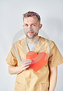 Valentine's Day: young male doctor or nurse in uniform