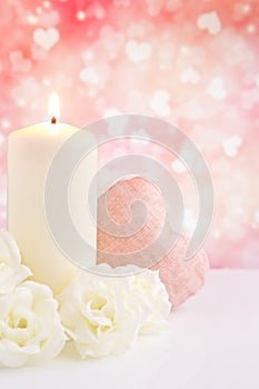 Valentine's hearts and candle with a bright background