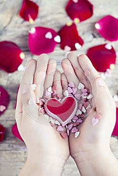 Valentine`s hearts in hands