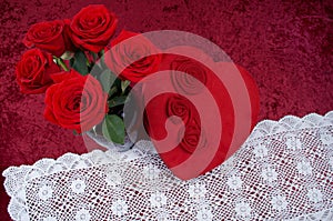 Valentine Themed Background With Heart-shaped Chocolate Box and Red Rose Bouquet on Red Crushed Velvet Background