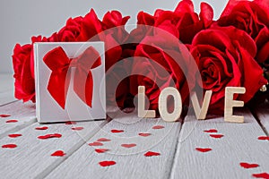 Valentines background with red rose, Heart shape, Gift box, Wooden letters word