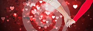 Valentines couple holding hands and love hearts background