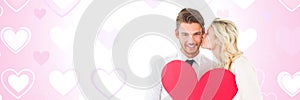 Valentines couple holding heart with love hearts background