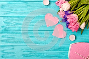 Valentines Day background with bouquet of tulips, a valentine`s card and a gift.