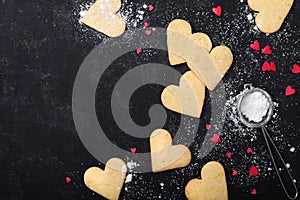 Valentines day background with cookies in shape of heart. Sweet baking. Top view.