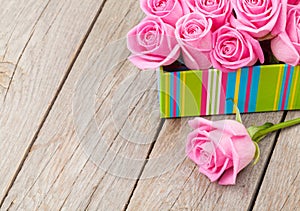 Valentines day background with gift box full of pink roses