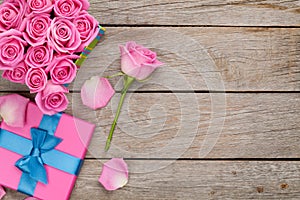 Valentines day background with gift box full of pink roses