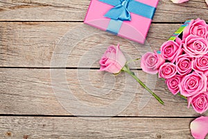 Valentines day background with gift box full of pink roses