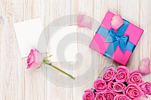 Valentines day background with gift box full of pink roses and t