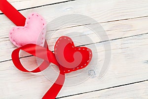 Valentines day background with handmade toy hearts