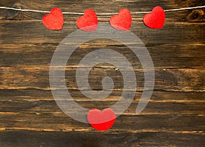 Valentines day background with hearts. Dark wooden background