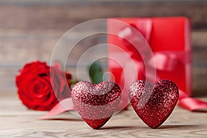 Valentines day background with hearts, gift and rose flower. 14 February greeting card.