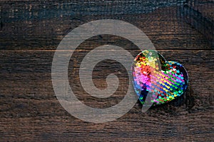 Valentines Day background, mockup with one Lgbt rainbow heart on rustic wooden background. Valentine Day, love, romance, dating
