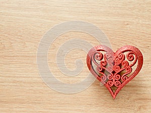 Valentines day background with red glitter heart on wood floor. Love and Valentine concept